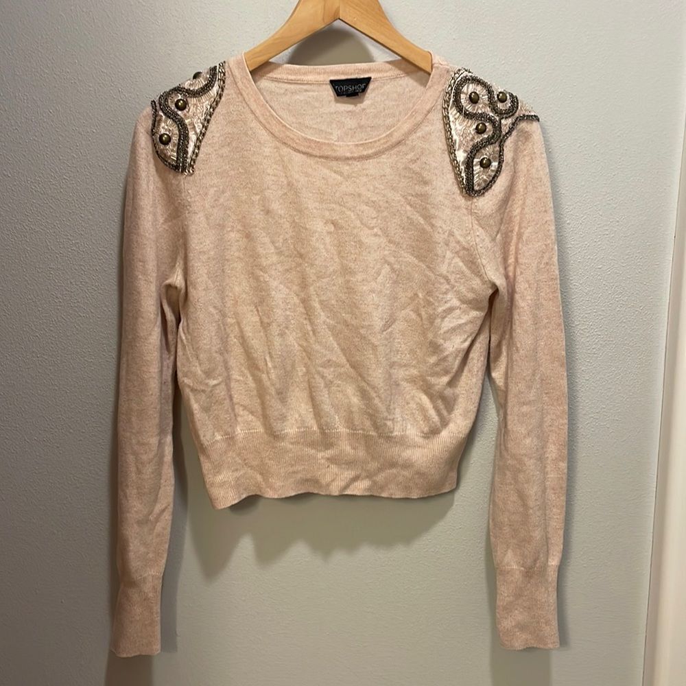 Topshop woman’s light pink long sleeve sweater with pretty embellishments.